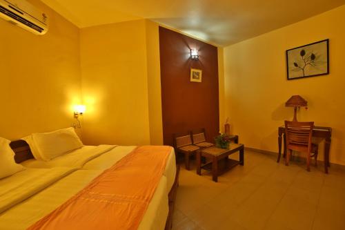 Cama o camas de una habitación en Deshadan Cliff & Beach Resort,Varkala