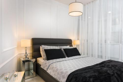 מיטה או מיטות בחדר ב-Luxury Studio Arc