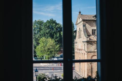 a view from a window of an old building at Palazzo Gozzi Bed & Beauty in Parma