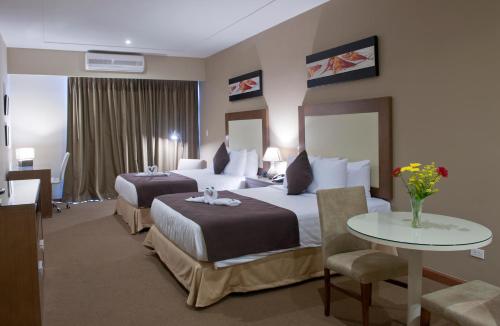 Кровать или кровати в номере Central Park Hotel & Casino