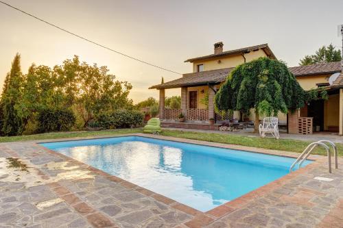 a swimming pool in front of a house at Secret Haven in La Croce