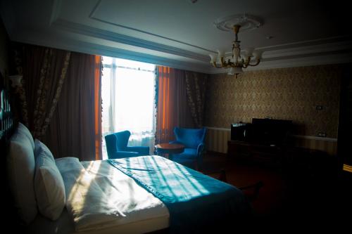 Ένα ή περισσότερα κρεβάτια σε δωμάτιο στο Sultan Plaza hotel