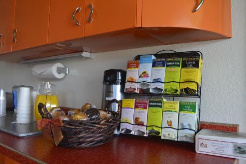 a counter top with a basket of food on it at Retro Inn at Mesa Verde in Cortez