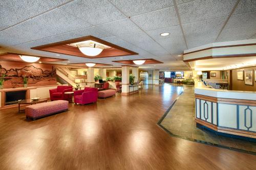a large lobby with red furniture in a hospital at Red Lion Hotel Boise Downtowner in Boise