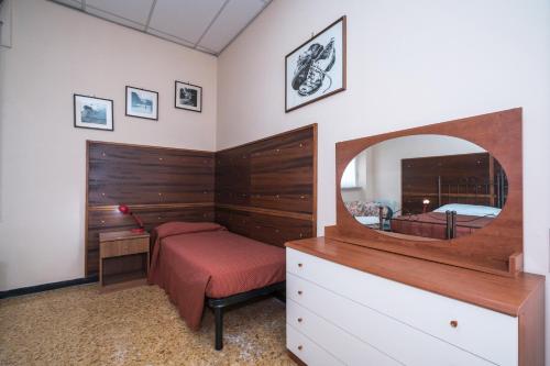 a bedroom with a bed and a large mirror at Hotel Ristorante Stella in Palestrina