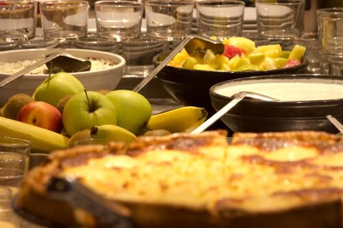 a buffet of food with apples and other fruits at ibis Paris Porte d'Italie in Paris