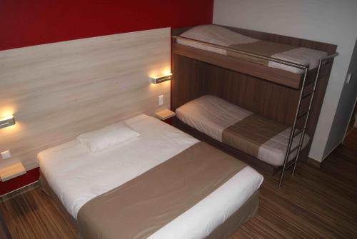 a small bedroom with two bunk beds in it at Ekho Hotel Grenoble Nord Saint Egrève in Saint-Égrève