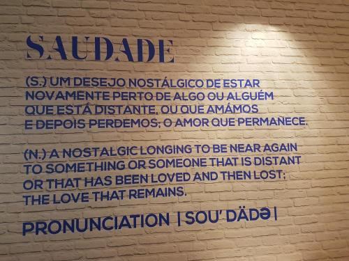 a wall with writing on the side of a building at Ulfilanis Vila in Fiães