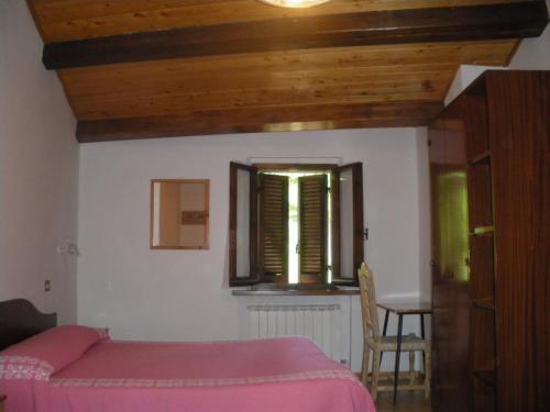 Postel nebo postele na pokoji v ubytování Agriturismo Orsaiola