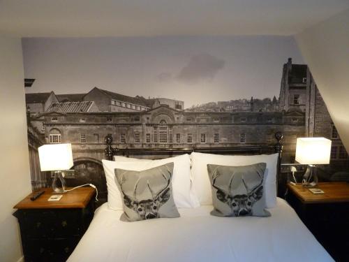 a bedroom with a bed with a drawing on the wall at Edgar Townhouse in Bath