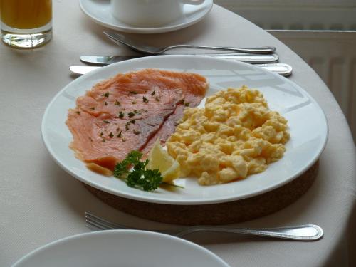 a white plate of food on a table at Edgar Townhouse in Bath