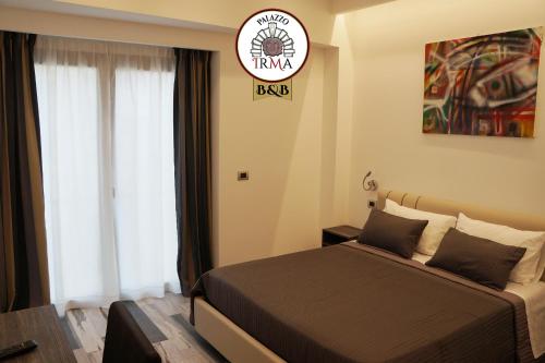 Ένα ή περισσότερα κρεβάτια σε δωμάτιο στο Palazzo IrMa - Hotel - B&B Luxury