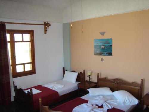 Posteľ alebo postele v izbe v ubytovaní Drapania Beach Marinakis