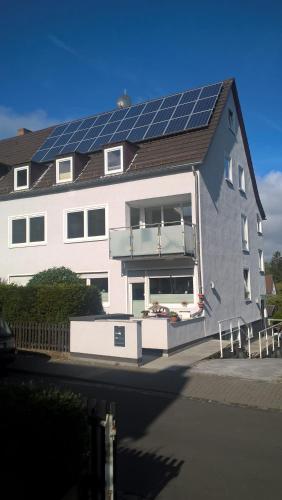 a house with a lot of solar panels on it at Familienzimmer in Kassel in Kassel