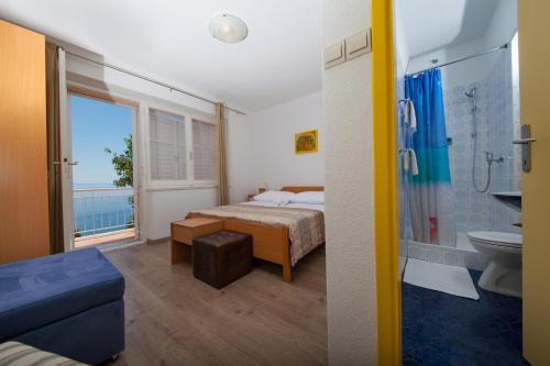 Ліжко або ліжка в номері Apartments Lusi