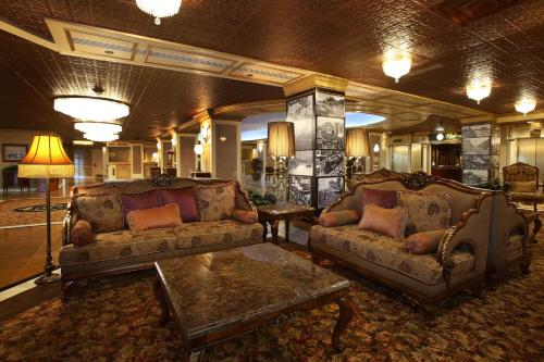 a living room filled with couches and chairs at The Claridge Hotel in Atlantic City