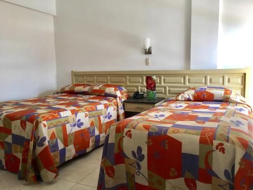Säng eller sängar i ett rum på Hotel del Valle
