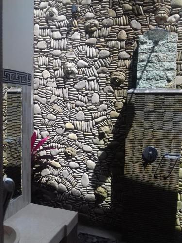 a wall with a painting of sheep on it at Villa Ketut Kartika in Ubud