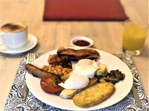 a plate of breakfast food on a table at Bed & Breakfast at Tiffany's in McLaren Vale