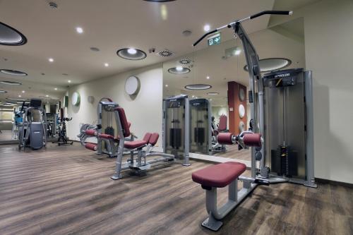 a fitness room with treadmills and machines at Vip Casa Club Zlatibor in Zlatibor