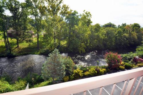 a view of a river from a balcony at Rivergate Mountain Lodge in Pigeon Forge