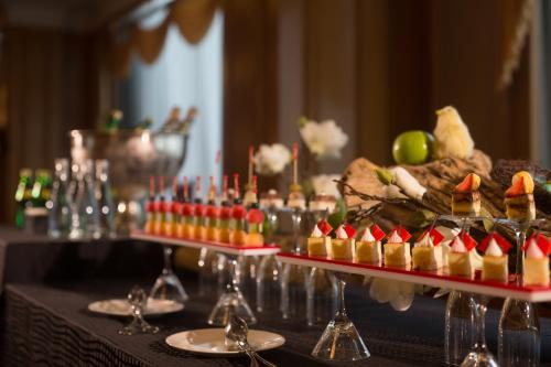 a buffet of food and drinks on a table at Shangri-La Harbin in Harbin