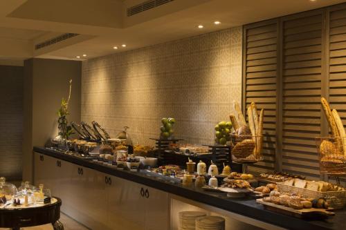 a buffet line with food on a table in a room at Mayfair Hotel in Adelaide