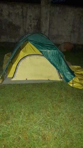 a yellow and green tent sitting on the grass at Martvili Newhotel in Martvili