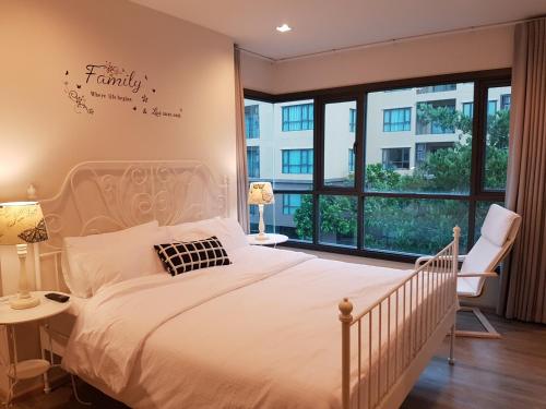 Säng eller sängar i ett rum på The Rain Cha-am Huahin By Thanon