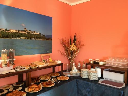 a buffet of food on a table in a room at Le Macerine in Castiglione del Lago