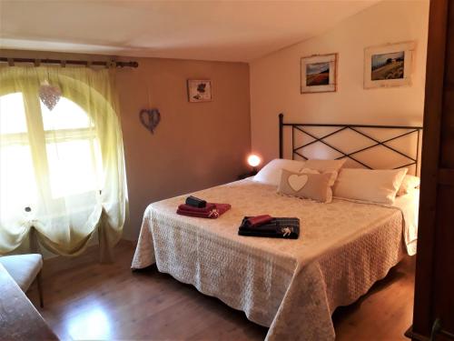 Кровать или кровати в номере Agriturismo San Giacomo