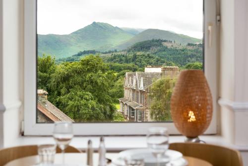 a window with a view of a mountain view at Balmoral Apartment in Keswick