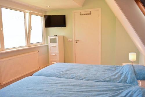 Postel nebo postele na pokoji v ubytování Vroonweg 34 sauna sunshower