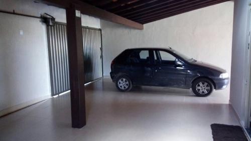 a small black car parked in a garage at Casa Em Capitolio in Capitólio