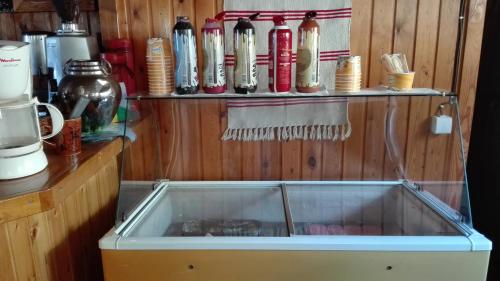 a sink in a kitchen with a bunch of dishes at Livadaki Village in Megáli Kápsi
