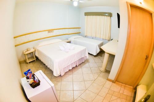 מיטה או מיטות בחדר ב-Hotel Center