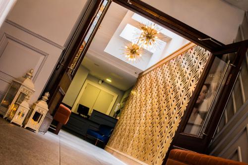 a hallway with a staircase in a building at Shipquay Boutique Hotel in Derry Londonderry