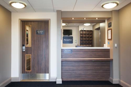 a view of the cashier counter in a hospital lobby at Lobster Pot, Bridlington by Marston's Inn in Bridlington