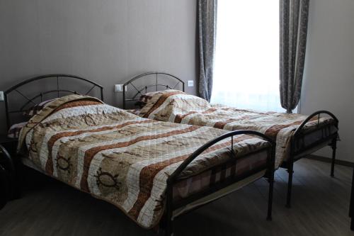 Кровать или кровати в номере Guest House on Gia Abesadze Street