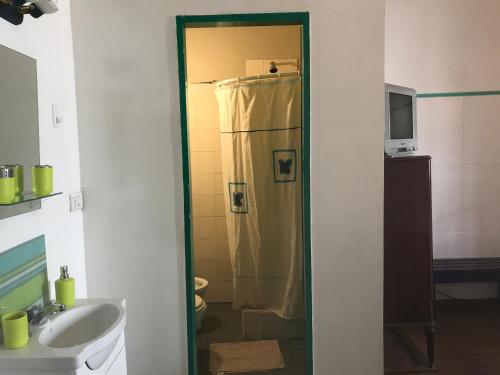 a bathroom with a shower and a sink at Posada Casa de Borgoña in Salta