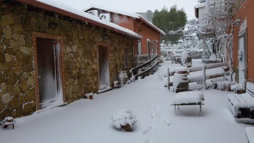 a street covered in snow next to a building at Agriturismo la stragola in Nicosia