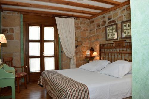 Säng eller sängar i ett rum på Posada Las Mayas