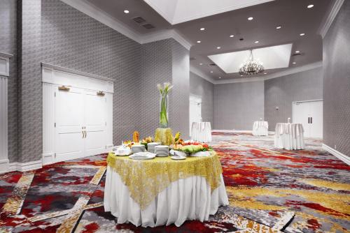 a large room with a table with fruit on it at DoubleTree by Hilton Dallas Near the Galleria in Dallas