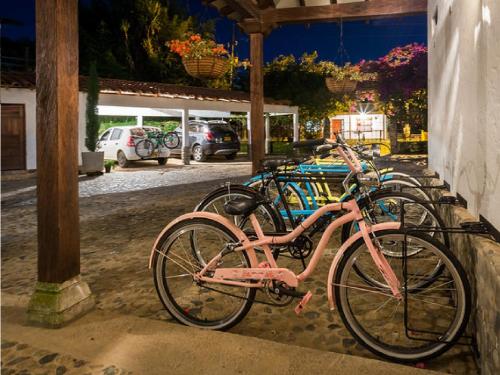 a pink bike parked next to a building at Casa Santamaria Hotel Campestre in Jericó