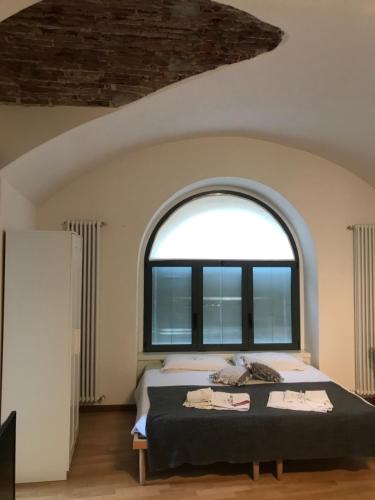 Postel nebo postele na pokoji v ubytování MyRoom Città Alta 2