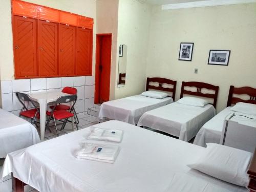 Кровать или кровати в номере Pousada Terra do Sol