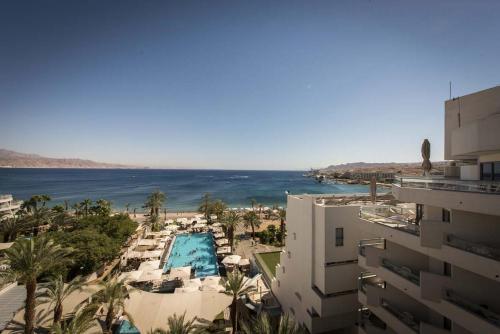 a view of the ocean from a building at Neptune Eilat By Dan Hotels in Eilat
