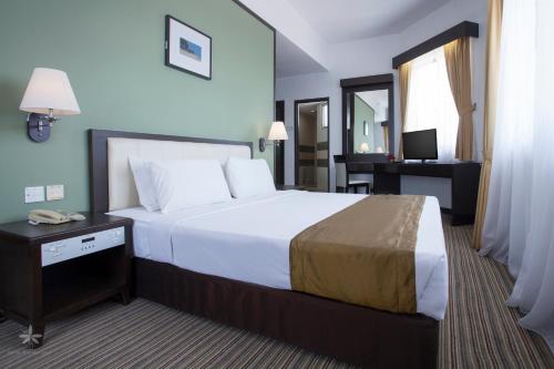 Кровать или кровати в номере Hotel Seri Malaysia Kepala Batas