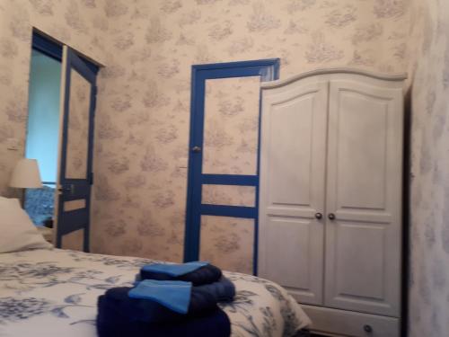 a bedroom with a bed with a ladder next to a door at Villa SAINT-PRIVAT in Pouzilhac