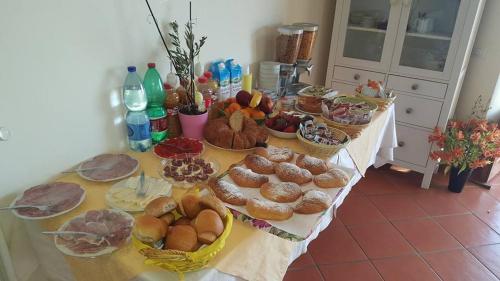a table topped with lots of different types of food at Casa Falcone B&B in Scala